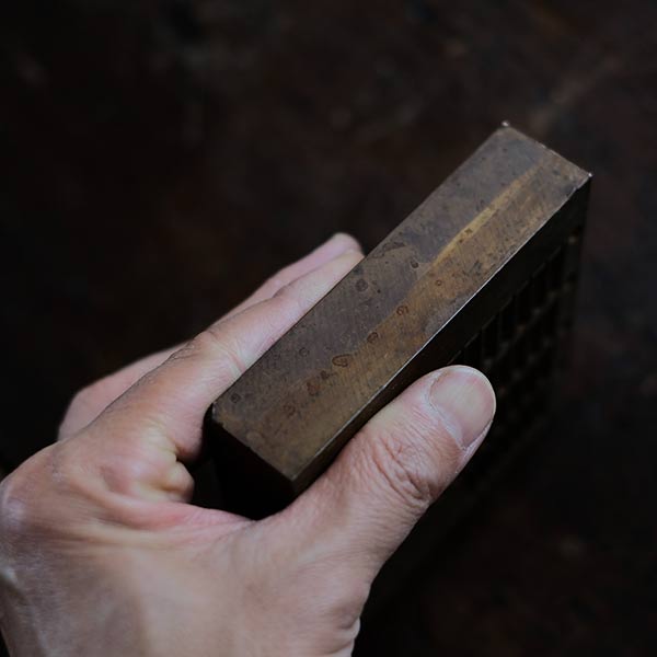 A stamped copper block
