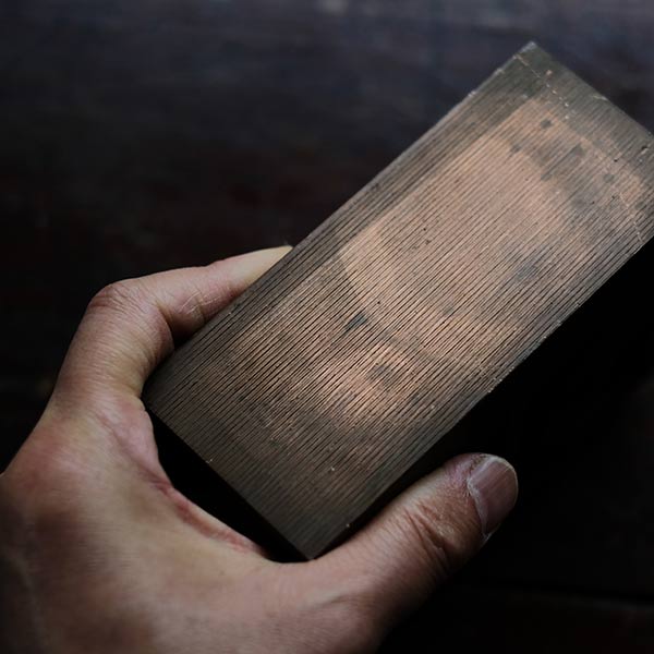 A stamped copper block