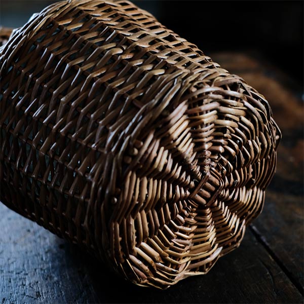 Rattan-wrapped glass bottle
