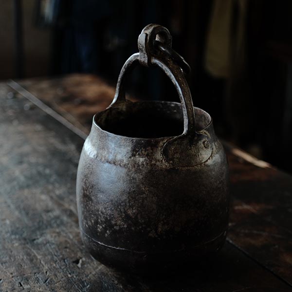 Iron bucket in a well