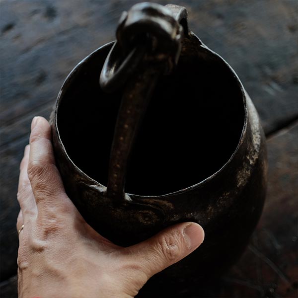 Iron bucket in a well