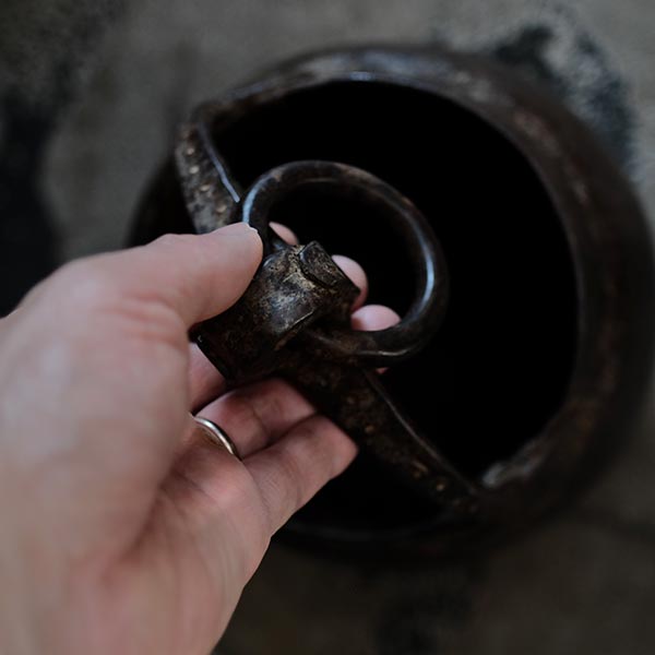 Iron bucket in a well