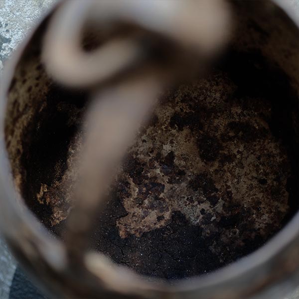Iron bucket in a well