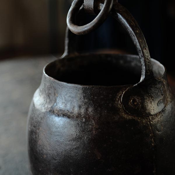 Iron bucket in a well