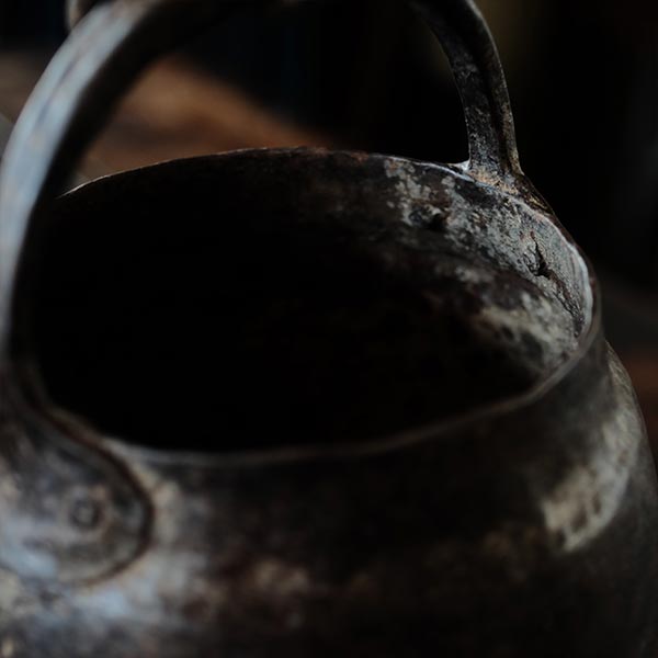Iron bucket in a well