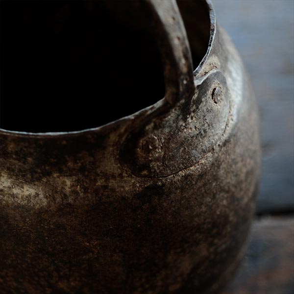 Iron bucket in a well