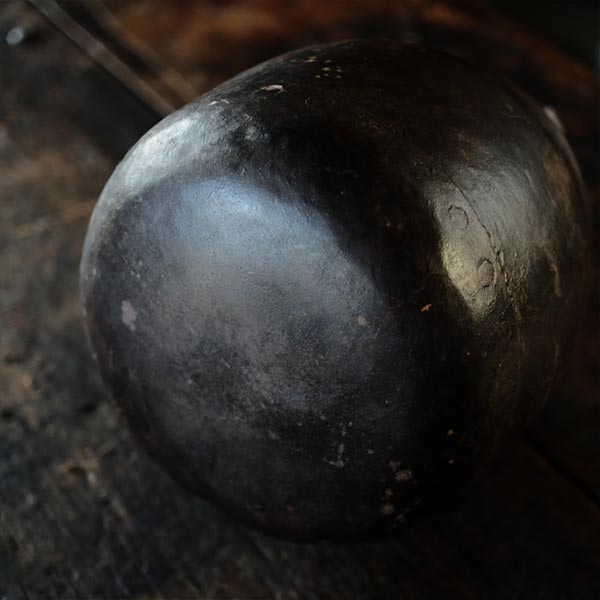 Iron bucket in a well