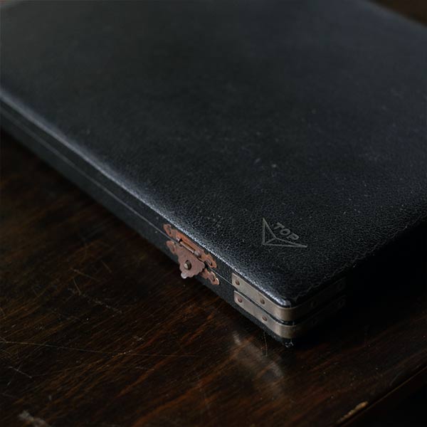 A set of small jars containing mechanical watch parts