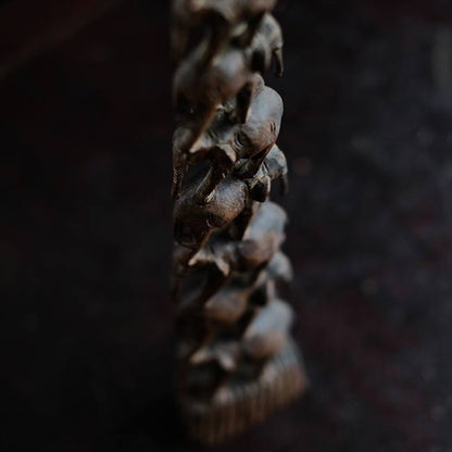 Eight carved wooden elephants