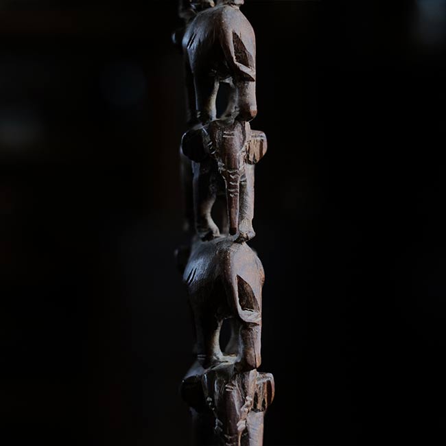 Eight carved wooden elephants