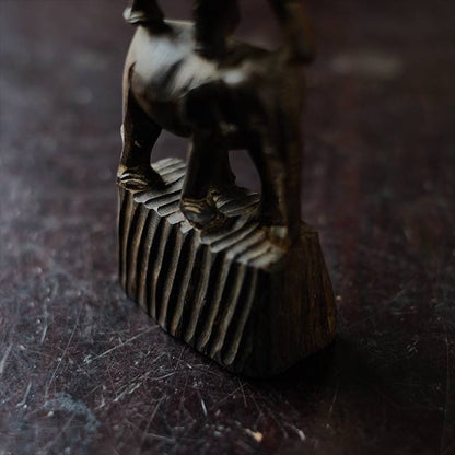 Eight carved wooden elephants