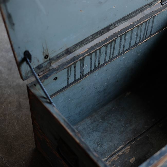 Wooden box with peeling paint