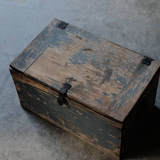 Wooden box with peeling paint