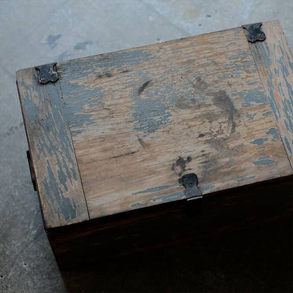 Wooden box with peeling paint