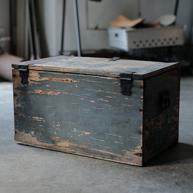 Wooden box with peeling paint