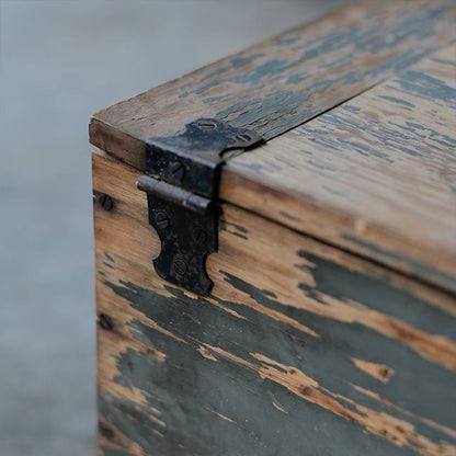 Wooden box with peeling paint