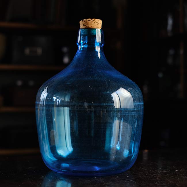 Small blue demijohn bottle