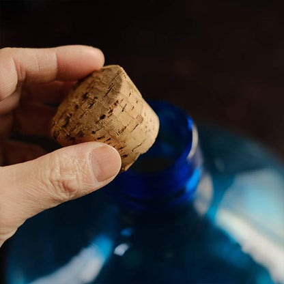 Small blue demijohn bottle