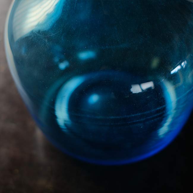 Small blue demijohn bottle