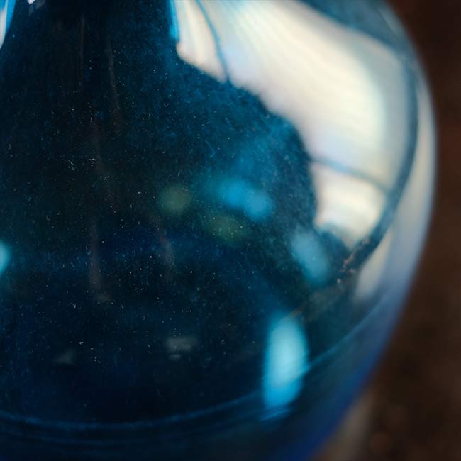 Small blue demijohn bottle