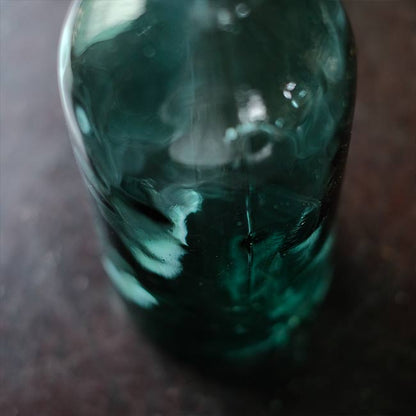 Aqua green medicine bottle