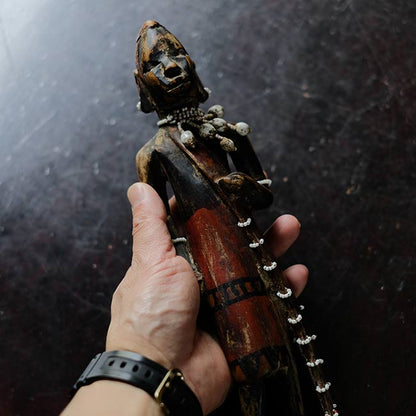 Wooden carving of a Masai woman