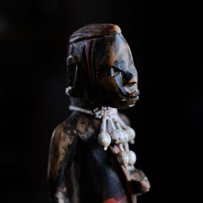 Wooden carving of a Masai woman