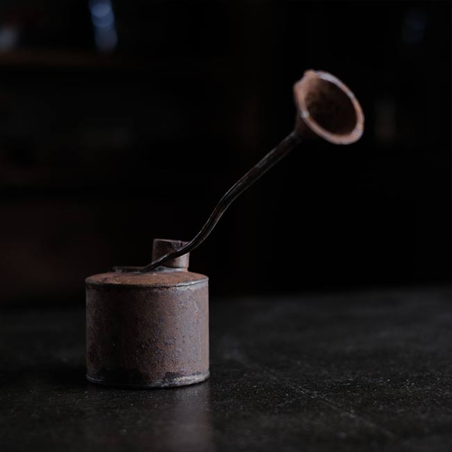 can with a funnel