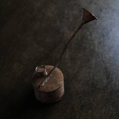 can with a funnel
