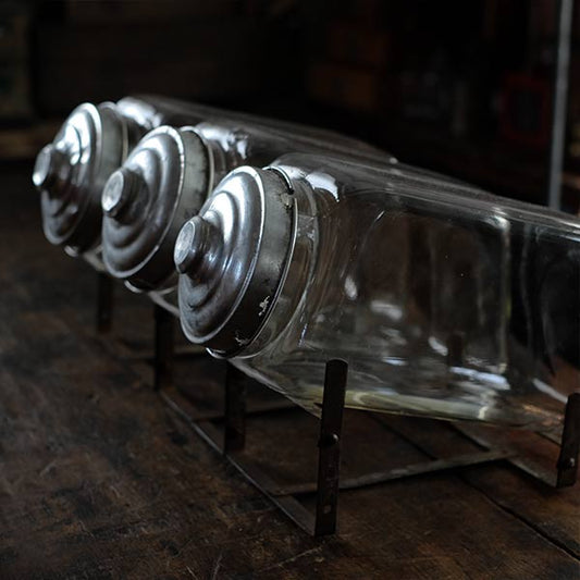 Three carefully used candy jars