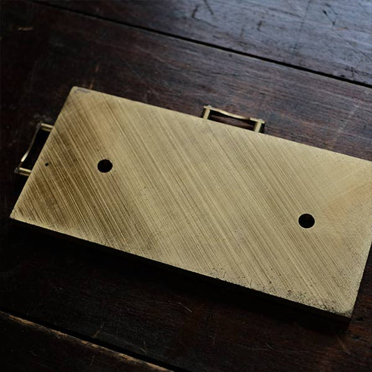 Brass plate with a small handle