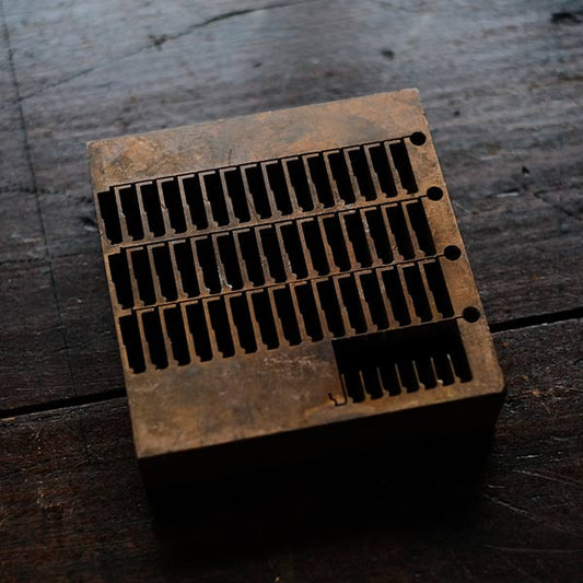 A stamped copper block