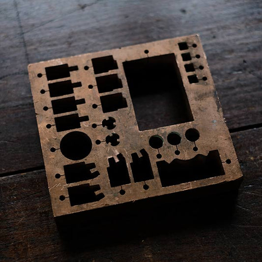 A stamped copper block