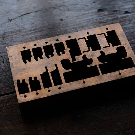 A stamped copper block