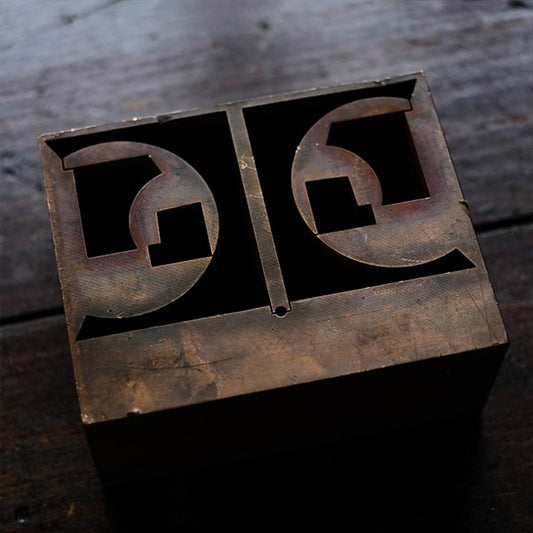 A stamped copper block