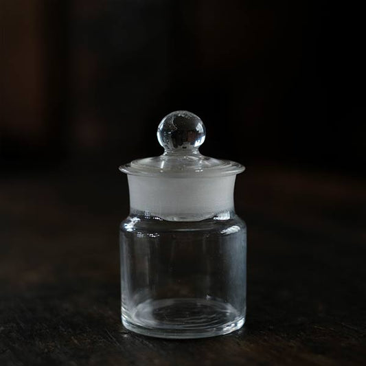 A small bottle containing dye