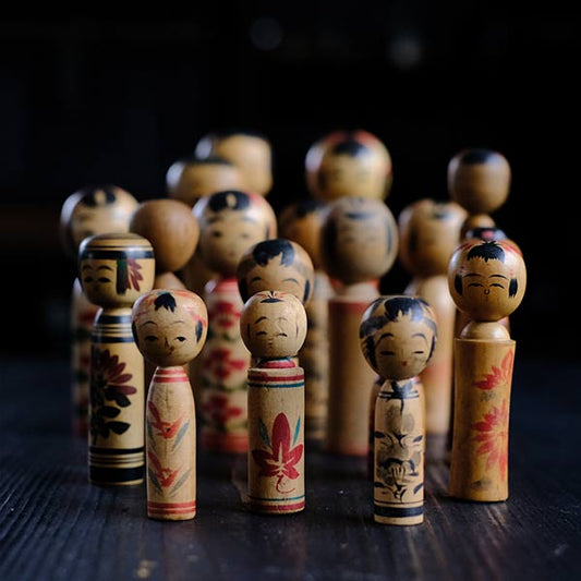 Set of 18 small kokeshi dolls