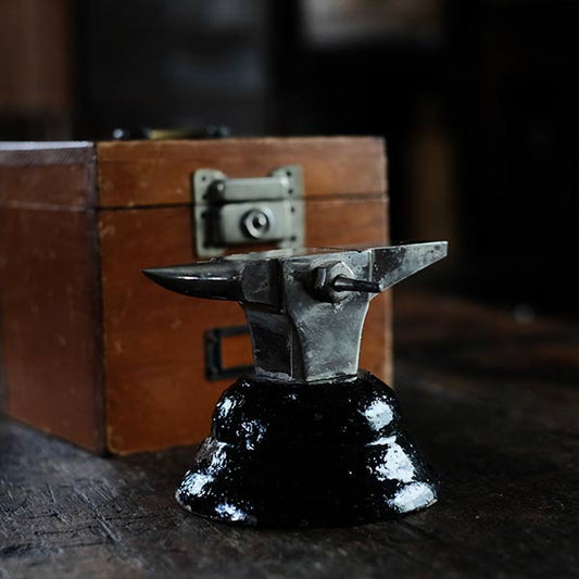 Watchmaker's anvil with wooden box