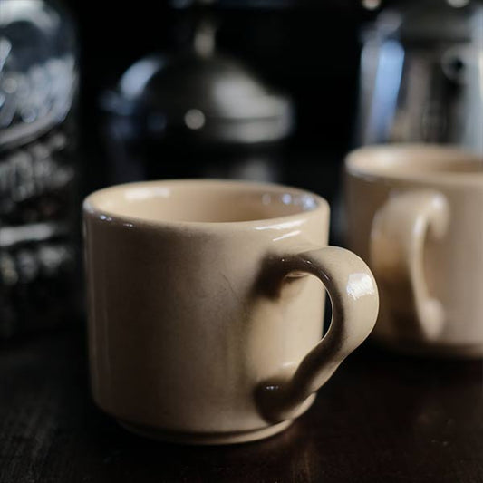 Anonymous beige mug