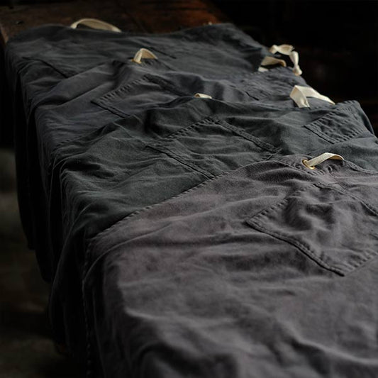 Faded navy blue work apron